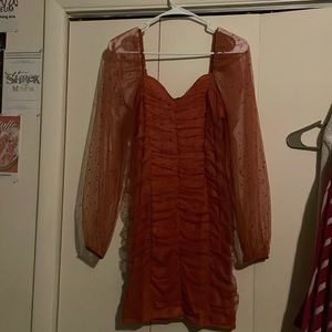 rusty pinkish orange mini dress with sheer dotted sleeves